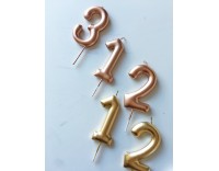 vela número metalizada